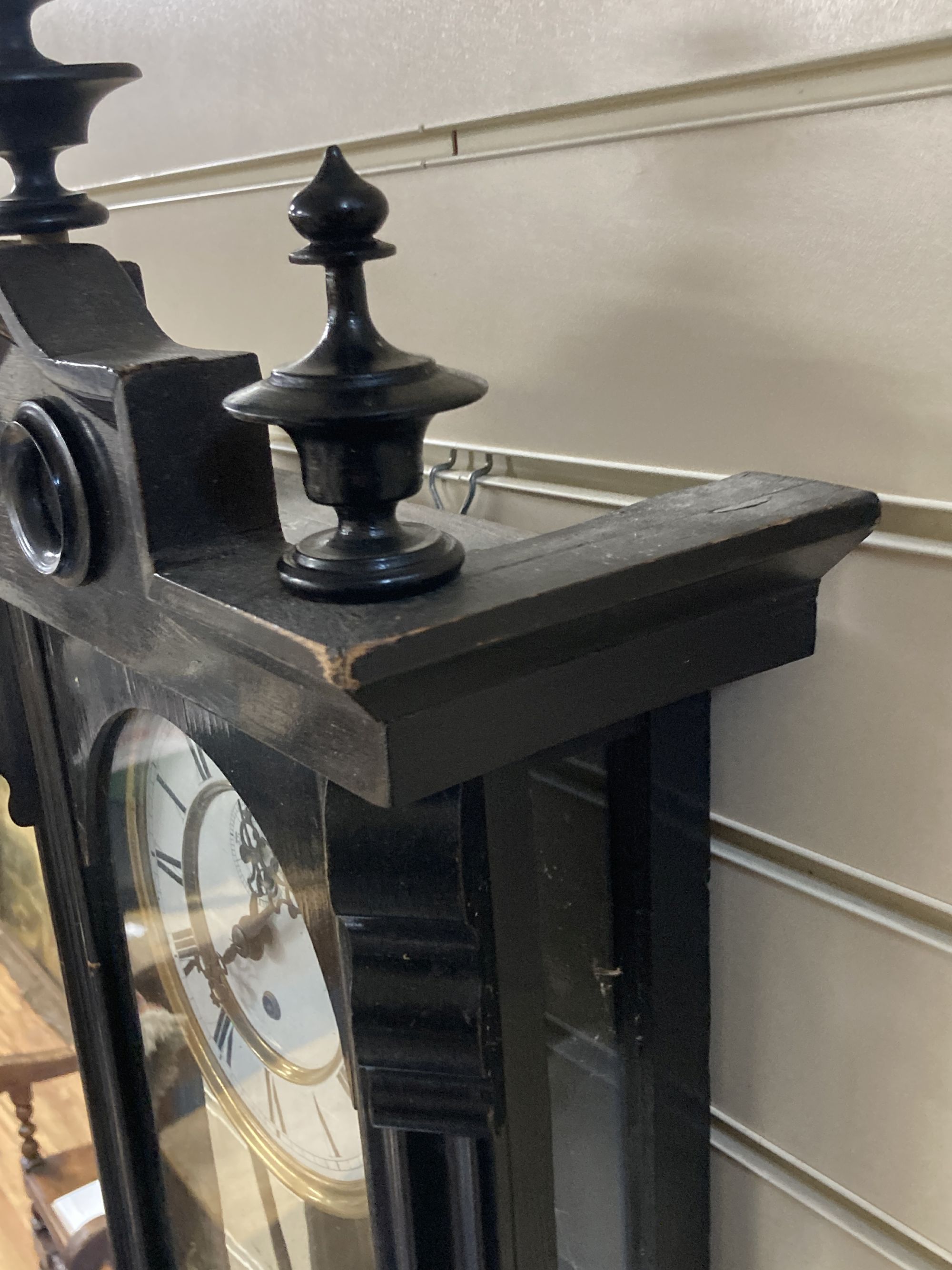 An early 20th century ebonised Vienna wall clock, height 106cm